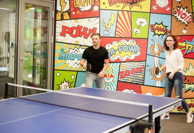 Two Centric colleagues from Managed Services taking a break playing table tennis ping pong