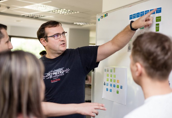 Centric developer architect explaining a product at a whiteboard
